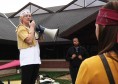 3 copyWPWEB EVAN MUELLER / The Journal Emily Anderson, a junior international human rights major, holds a megaphone and leads chants in favor of the people of Burma at a march on campus April 7.