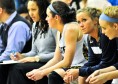 From right to left: Webster University freshman Kylie Fenemor, sophomore Hillary Trimble and junior Maggie Zehner watch from the bench during their team’s 81-65 loss to Eureka College on Feb. 4 at Grant Gymnasium. PHOTO BY SEAN SANDEFUR.
