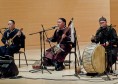 Three members of the Alash ensemble, a Tuvan throat singing group, perform in the Community Music School. PHOTO BY MAX BOUVATTE