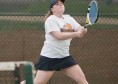 Webster University sophomore Kathleen Kennedy chases a ball that eventually landed out during her doubles match against Missouri Baptist University on Tuesday, April 9 at the Webster Groves Tennis Center. Kennedy possess a 21-0 overall record in her matches in 2013. PHOTO BY BRITTANY RUESS.