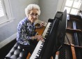Juanita Hibbett, 92, plays piano in her home on Catalina Avenue in Webster Groves. She has lived in her home since 1958. She sold her home to Webster University two years ago but still lives there rent-free.