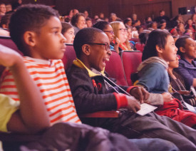 HANNAH ROLING / The Journal
Wyland Elementary student Javier Brown laughs amongst his classmates at The Repertory Theatre of St. Louis, where they are gathered to watch 15 plays written by their peers and performed by professional actors.