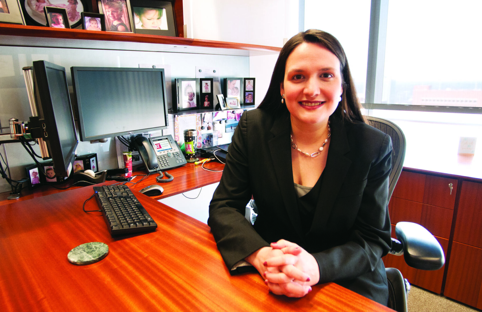 Executive smiling at workplace desk