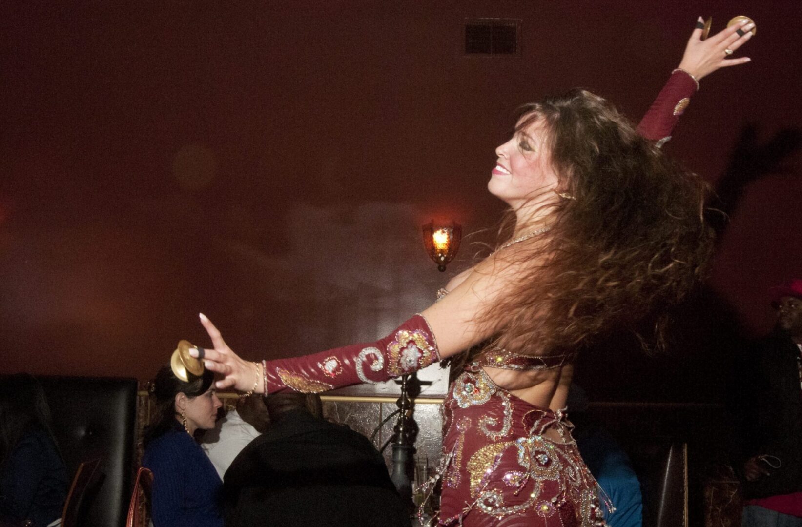 Vibrant dance performance at a dimly lit venue