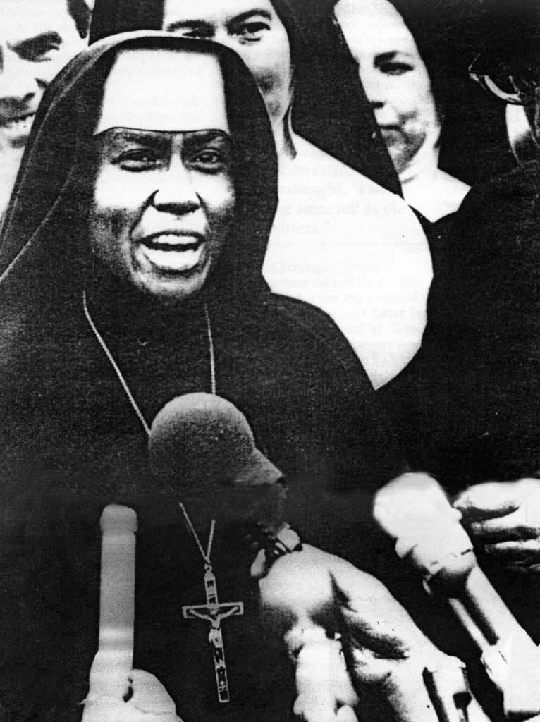 Nun speaking at a press conference