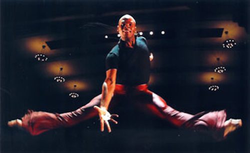 Athlete executing a mid-air split jump