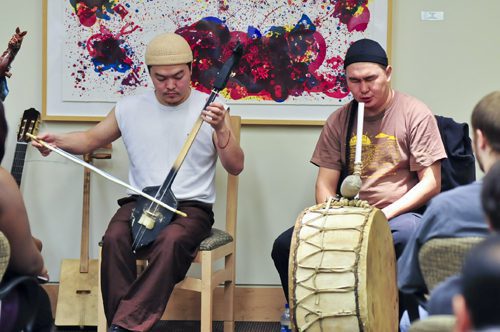 Cultural music performance with colorful backdrop