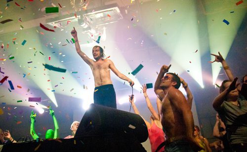 Concert crowd celebrating with confetti