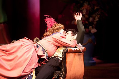 Theatrical scene with dramatic embrace