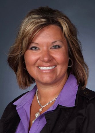 Smiling woman in a purple shirt