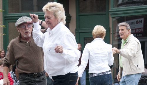 Group of seniors dancing outside