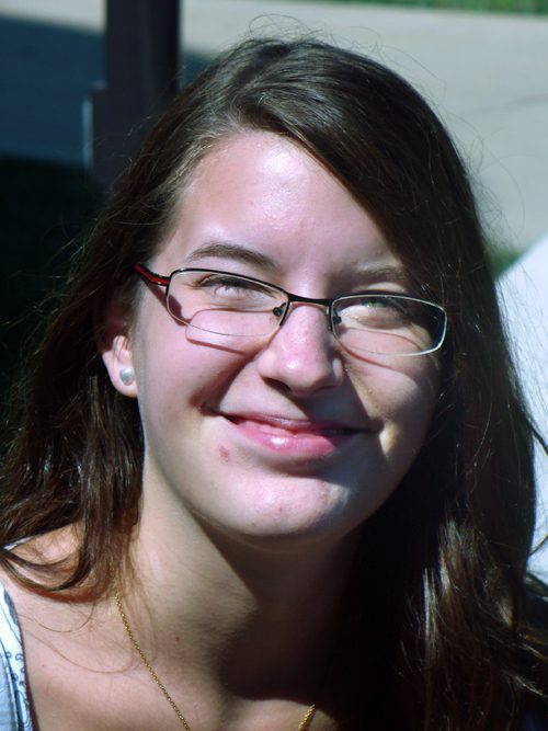 Woman squinting in sunlight