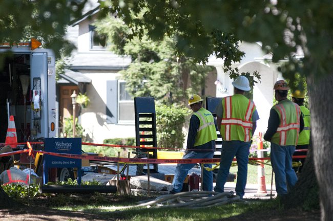 Workers in safety vests at construction site
