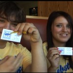 Students holding suicide awareness cards