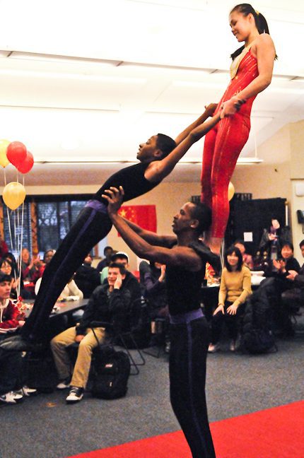Trio of acrobats showcasing strength and balance.