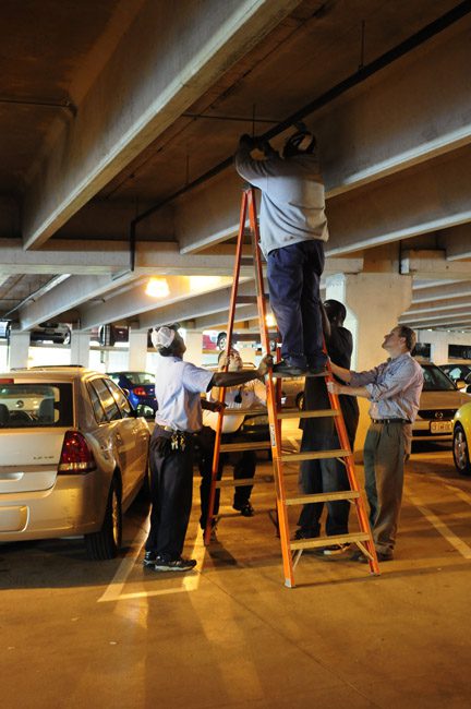Team repairing in underground parking lot