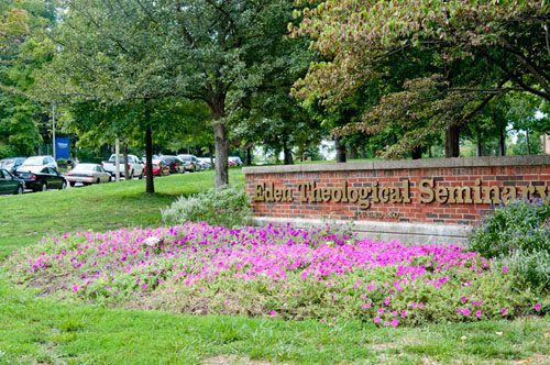 Flower bed near brick sign