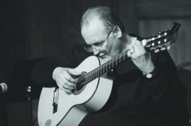 JOURNAL ARCHIVES / The Journal John McClellan plays a classical guitar during his “Tribute to Chet Atkins” concert at the Sheldon Concert Hall on Wednesday, Oct. 24, 2012 McClellan was promoting the release of his album “Slightly Above Below Average: A Tribute to Chet Atkins by His Friends.” McClellan is the director of the guitar department at Webster University.