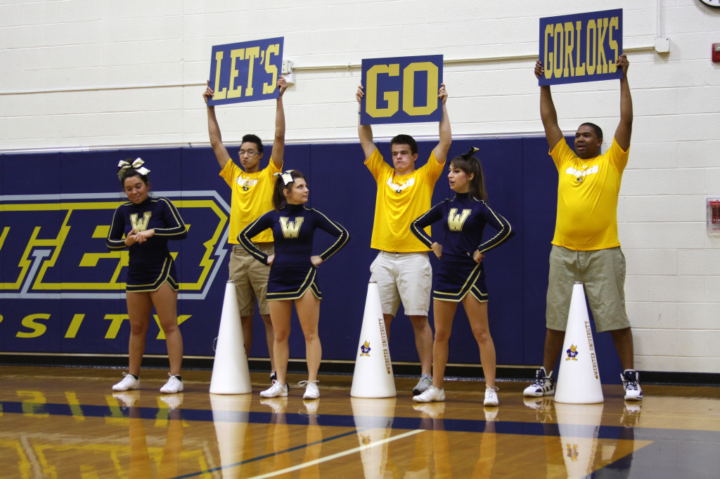 HOLLY SWAN / The Journal Webster University cheerleaders chant “Let’s go Gorloks” on the side line at the Gorlok’s basketball game Tuesday.