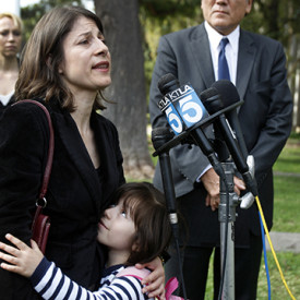 SANTA ANA, CA-NOV. 19, 2013:  Dr. Jorge Mancillas, right, listens to his wife, and daughter, Arianna Mancillas, 4, hugs her mom, Norma Esparza, left, while speaking during a press conference outside the Central Justice Center in Santa Ana Wednesday, Nov. 20, 2013.  (Photo By Allen J. Schaben / Los Angeles Times)