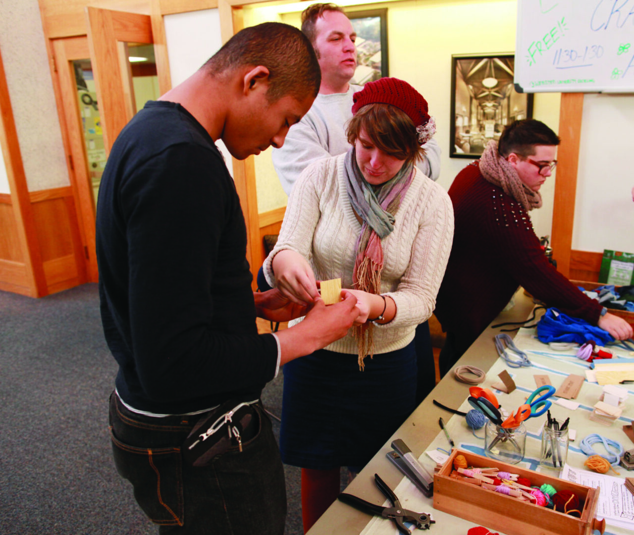 People collaborating at a craft workshop