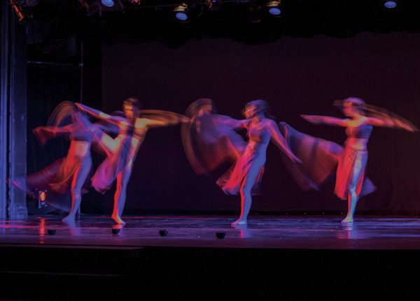 Dancers in motion on stage
