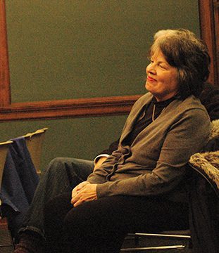 Relaxed woman in casual attire indoors