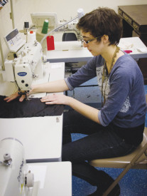 Sophomore costume designer Ruth Tully sews design sketches into costumes for Conservatory productions. PHOTO BY ERIN SHILDMYER/ The Journal