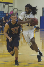 Aaron Griffin, a junior center, helped the Gorloks gain a win against MacMurry on Feb. 8, 2014.  The Gorloks have three more games until the conference tournament. MACKENZIE WILDER - The Journal