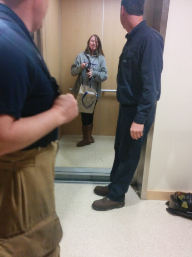 A student exits an elevator after being stuck for nearly two hours. PHOTO BY LIVIE HALL/The Journal