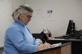 Mary Pat Gallagher, an adjunct professor, teaches an Intro to Mass Communications class in Sverdrup Hall on Monday night. She said one of Webster’s main selling points for students is its small class sizes. PHOTO BY MEGAN FAVIGNANO/The Journal