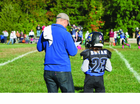 Photo Contributed by Tony Bryan Tony Bryan coaches his 11-year-old son Elijah’s football team. Bryan and his wife of nearly 20 years have four children. 