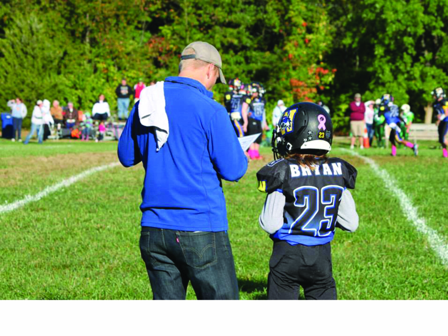 Football player number 23 with coach