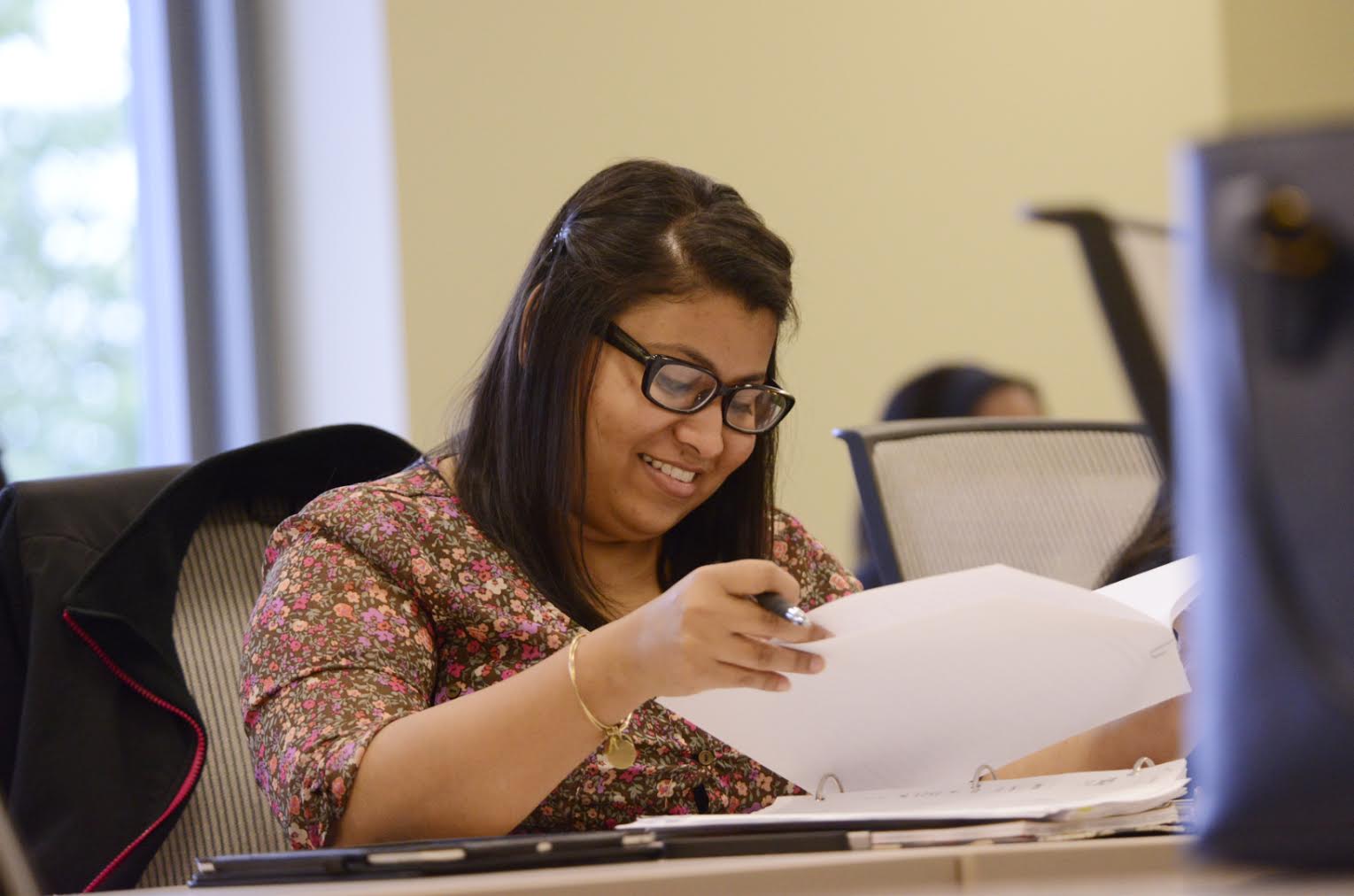 Woman reviewing documents at a desk