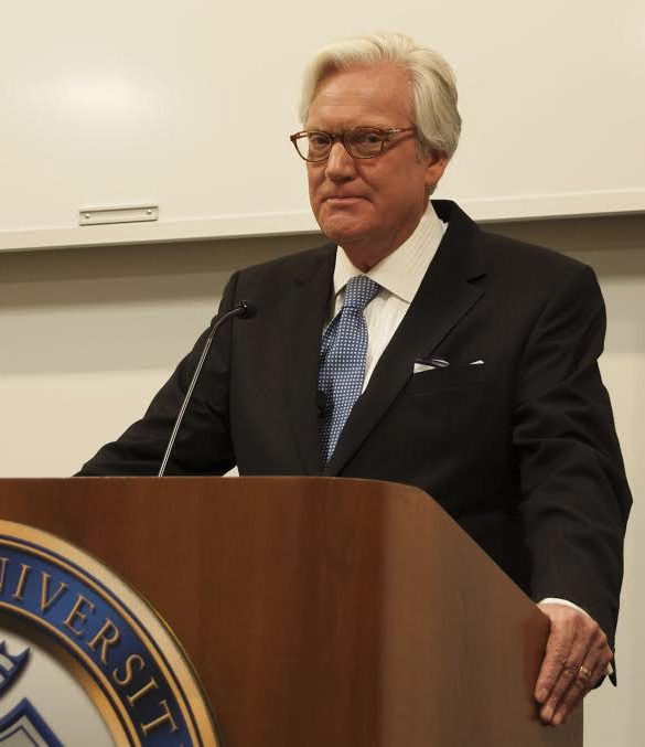 Man speaking at a podium