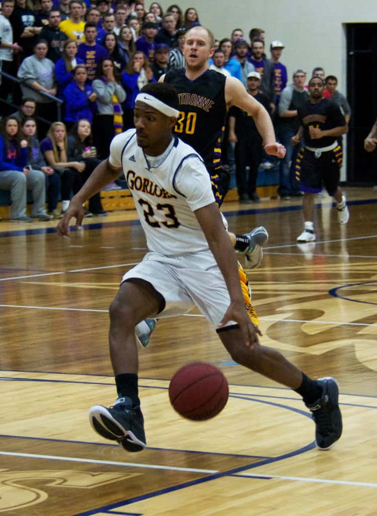 VICTORIA CASWELL/ The Journal Ahmad Smith drives to the rim in Webster’s SLIAC tournament loss to Fontbonne University at Grant Gymnasium.