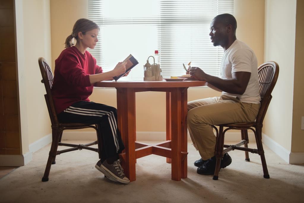 Casual indoor meeting between two individuals