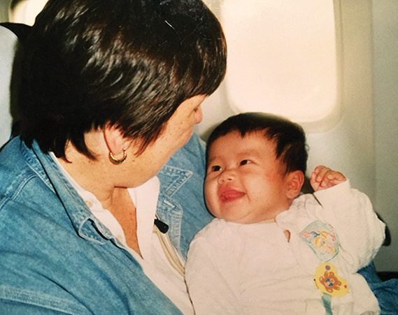 Baby and woman sharing a joyful moment