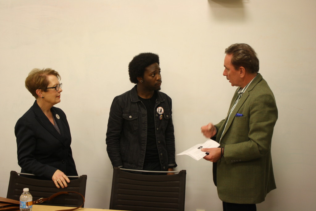 Association of African American Colleagues Treasurer Yai NIkos speak with President Elizabeth Stroble and Provost Julian Schuster after a meeting addressing what the group called systematic racism at Webster. 