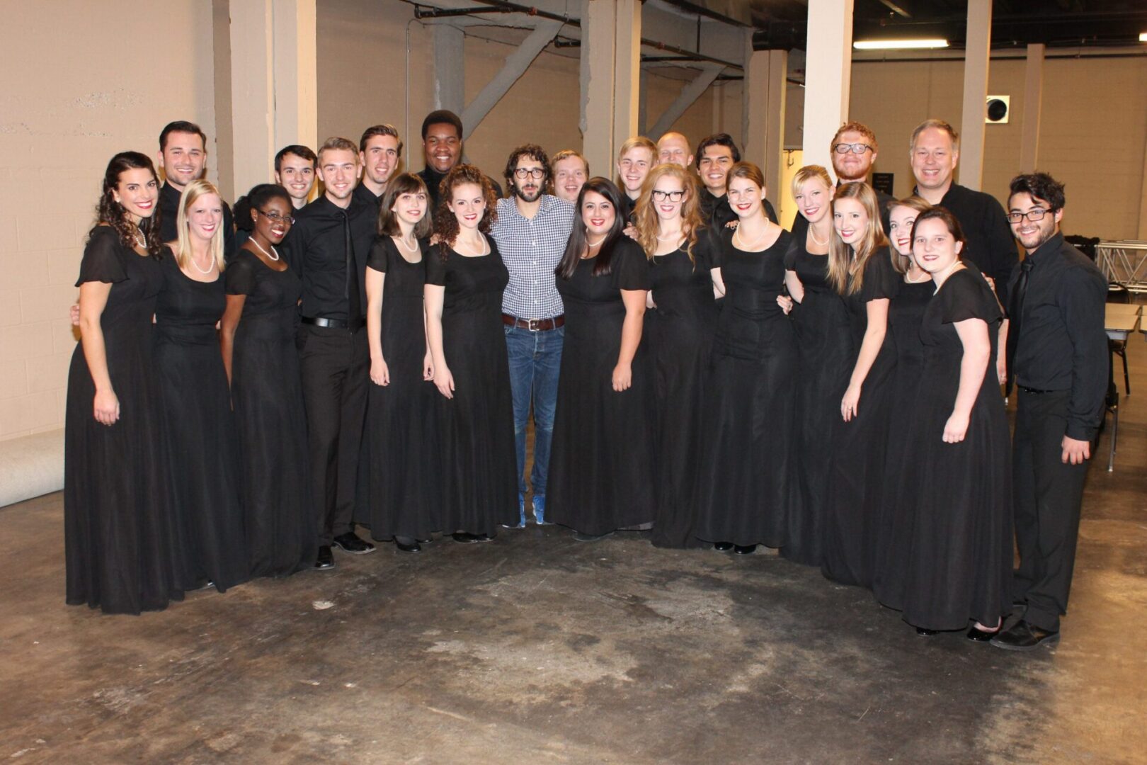 Group of performers in black attire