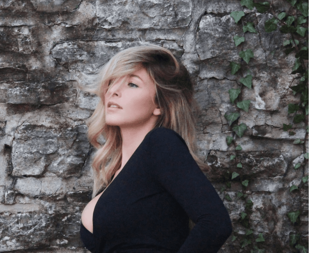 Stylish woman with ivy background