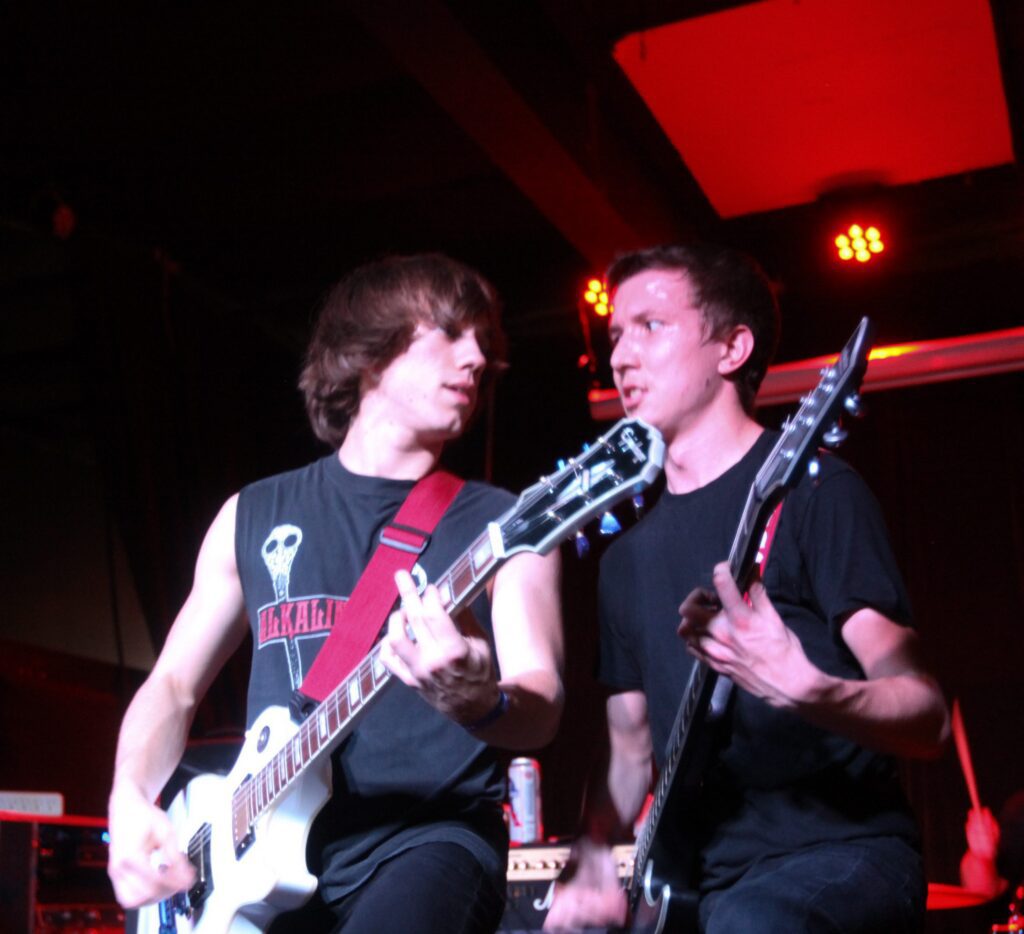 Musicians playing guitars on stage