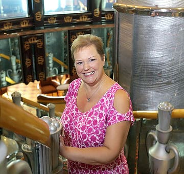 Woman posing in industrial-themed setting