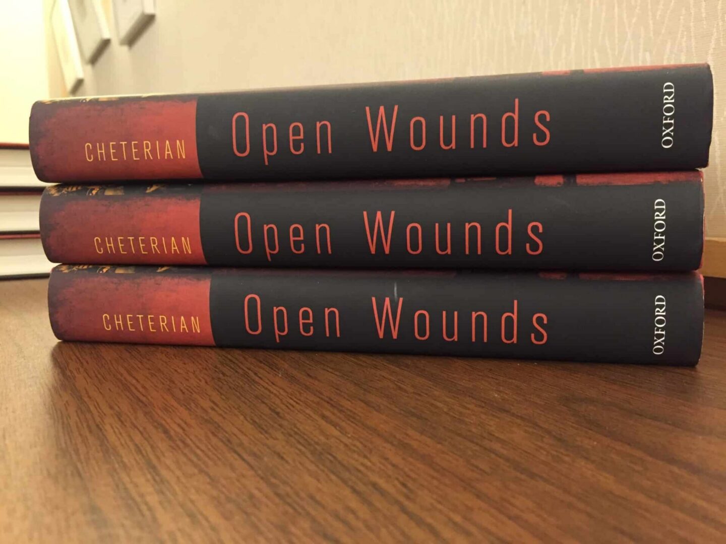 Three copies of "Open Wounds