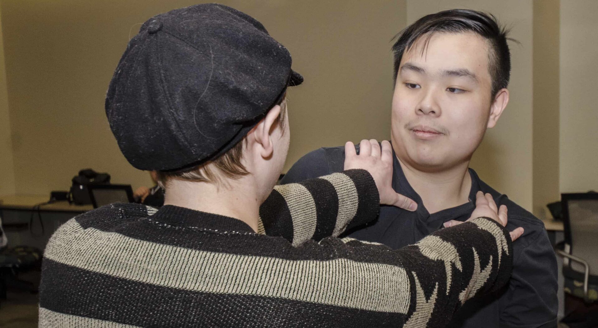 Self-defense training exercise between two individuals