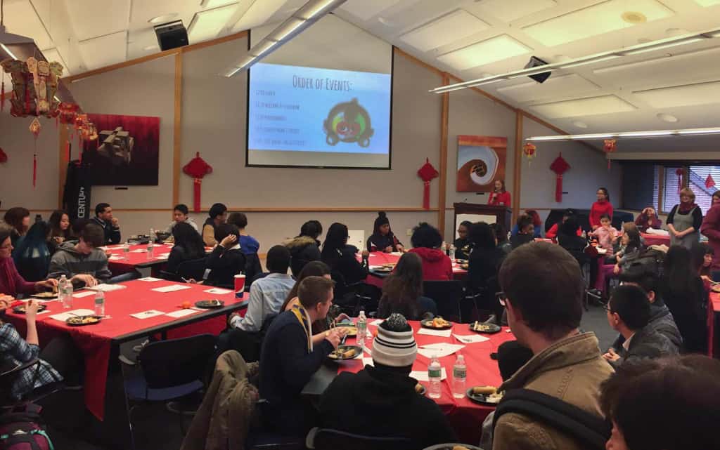 Students and faculty gather in the Sunnen Lounge to celebrate the Chinese New Year. YUE ZHANG / The Journal