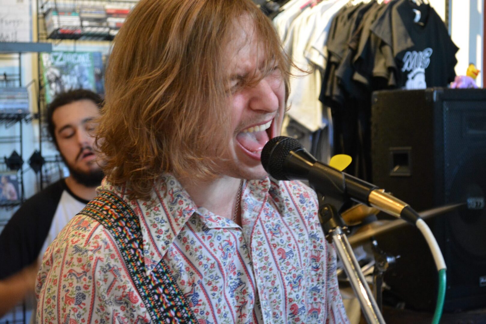 Singer performing passionately with microphone