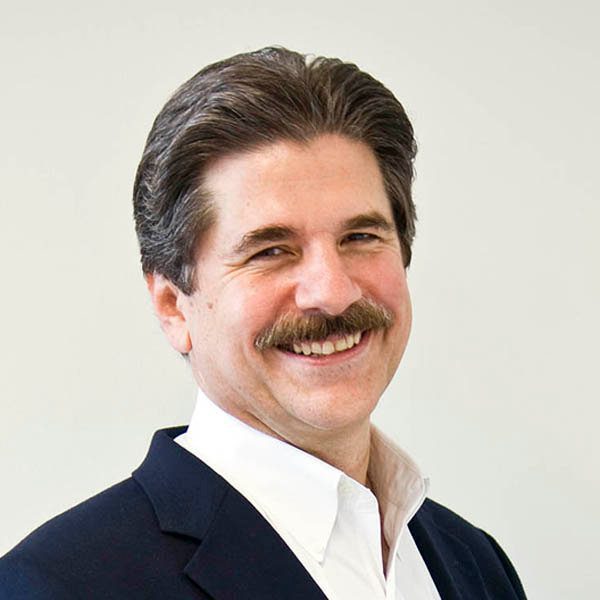 Man in a suit smiling
