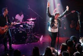 Musicians entertaining crowd at a show