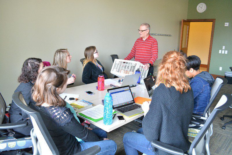 Meeting discussion around a conference table